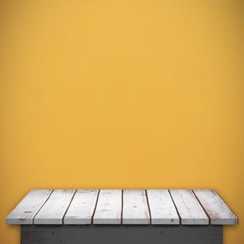 Wooden floor against orange background
