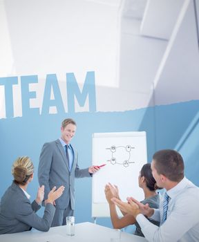 Manager presenting whiteboard to his colleagues against team