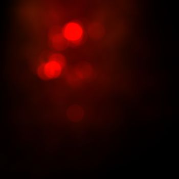 Dark background with red lights