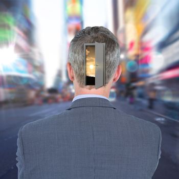 Rear view of businessman against blurry new york street