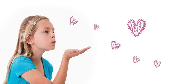 Red Hearts against a child blowing a kiss air