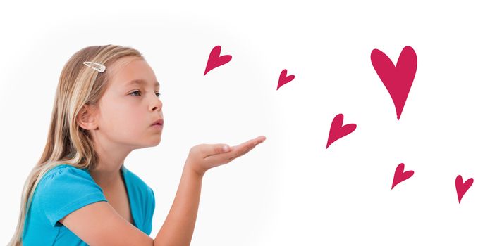 Red Hearts against a child blowing a kiss air