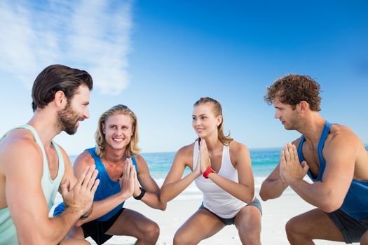 People exercising on the beach on a sunny day