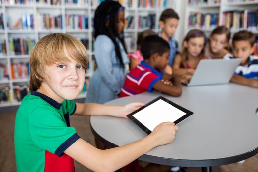 Pupils using technology in library