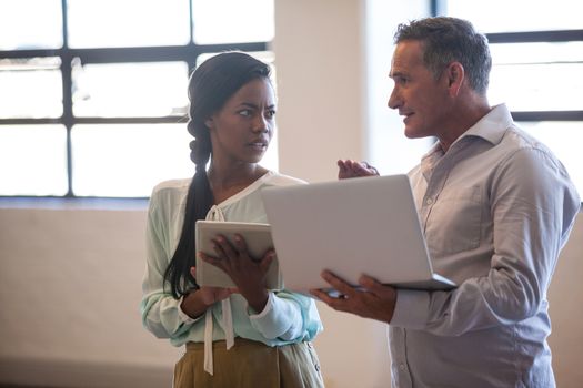 Two business people having a discussion in office