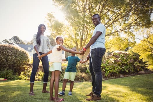 Happy family enjoying together at park