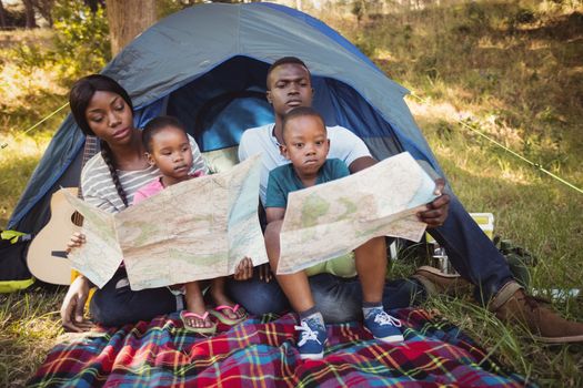 Happy family posing together at park