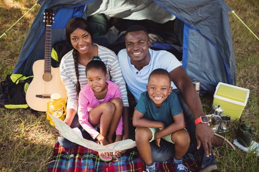 Happy family posing together at park