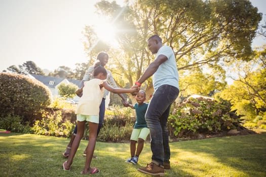 Happy family enjoying together at park