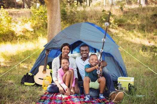 Happy family posing together at park