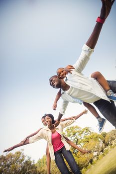 Happy family enjoying together at park