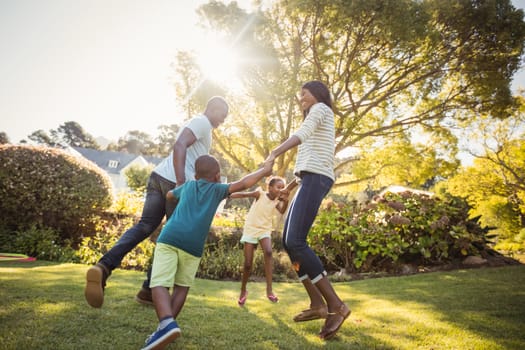 Happy family enjoying together at park