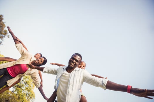 Happy family enjoying together at park