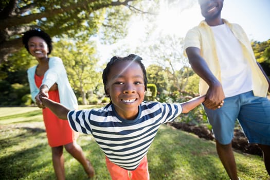 Happy family enjoying together at park