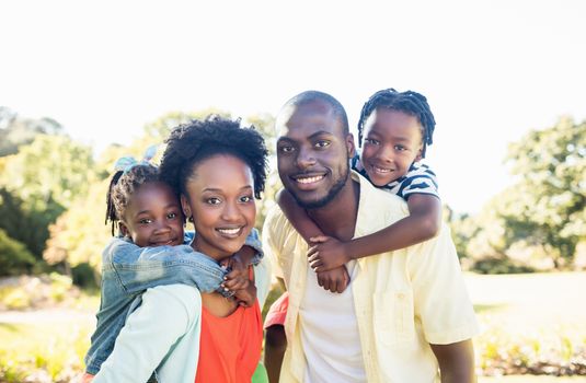 Happy family posing together at park