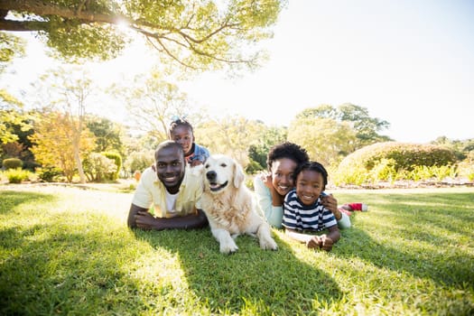 Happy family posing together at park