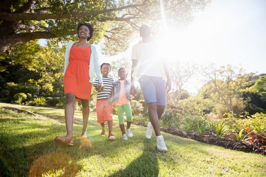 Happy family posing together at park