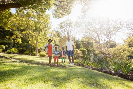 Happy family posing together at park