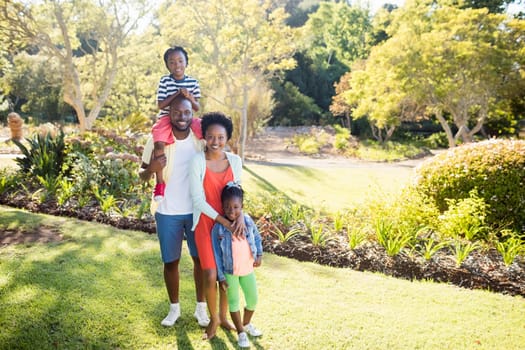 Happy family posing together at park