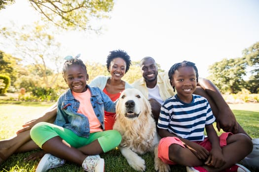 Happy family posing together at park