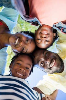 Happy family posing together at park