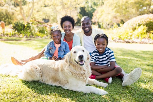 Happy family posing together at park