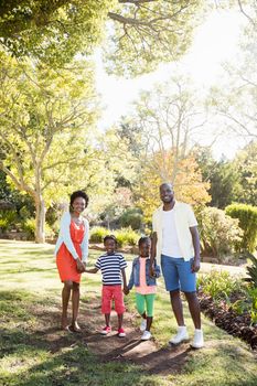 Happy family posing together at park