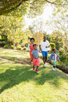 Happy family enjoying together at park