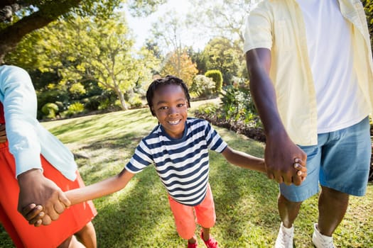 Happy family enjoying together at park