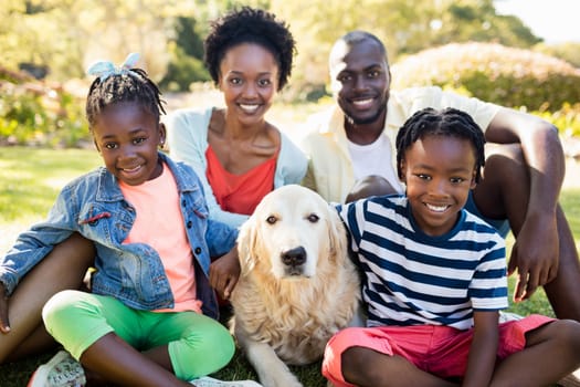 Happy family posing together at park