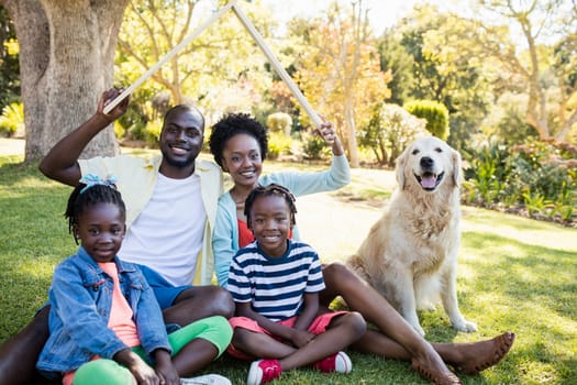 Happy family posing together at park