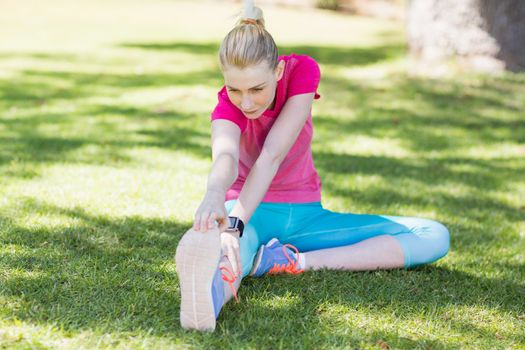 Young woman doing yoga in park