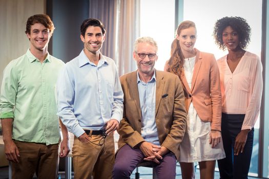 Portrait of business people smiling in office