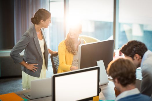 Business people working on computer in office