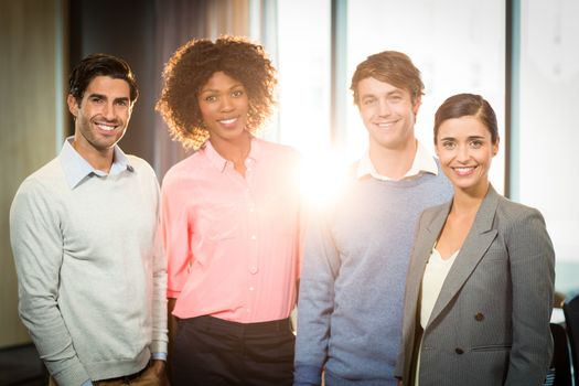 Portrait of business people smiling in office