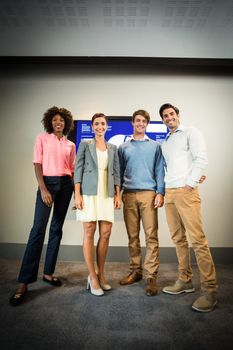 Portrait of business people standing in the conference room at office