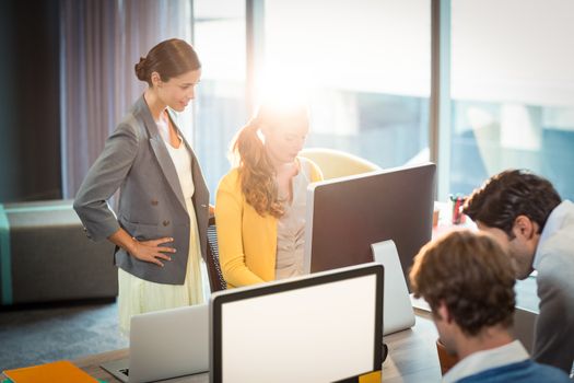 Business people working on computer in office