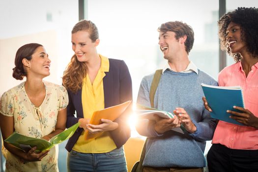 Business people holding files in office 