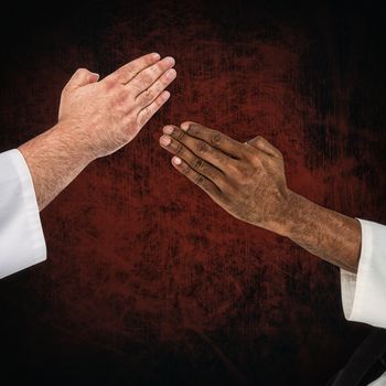 Close up view on hands against dark background