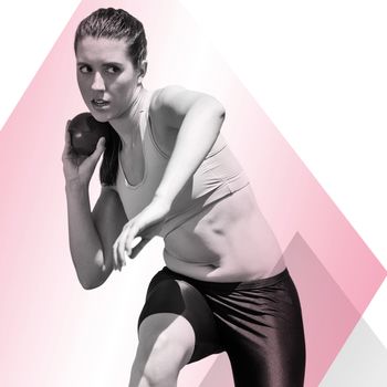 Sportswoman practising the shot put against different colors