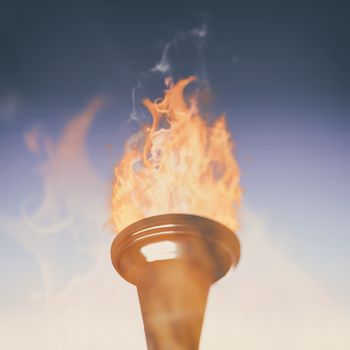 The olympic fire against blue and purple sky