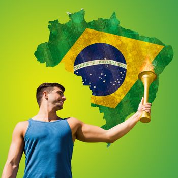 Low angle view of sportsman holding a cup  against green brazil outline with flag