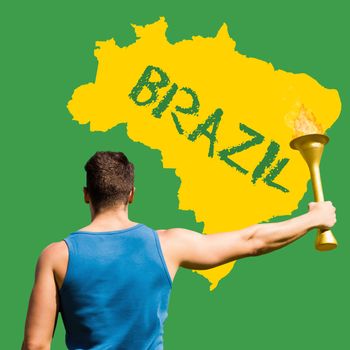 Rear view of sportsman holding a cup  against yellow brazil outline on green with text