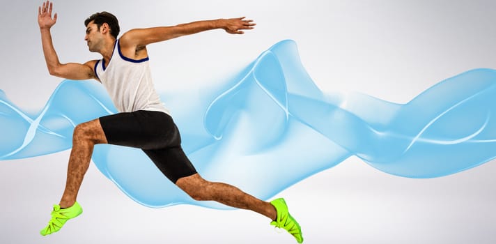 Male athlete running on white background against blue wave