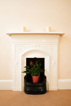 A traditional ornate iron fireplace from an 19th century English home.