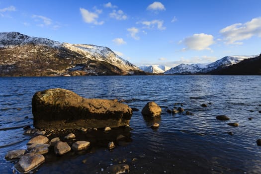 The view across Ullswater through Patterdale in the English Lake District national park.