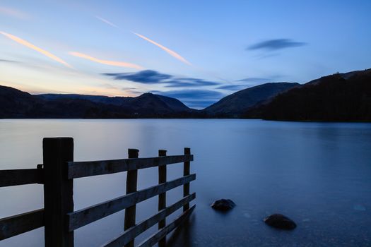 The view across Grasmere at dusk in the English Lake District National Park.