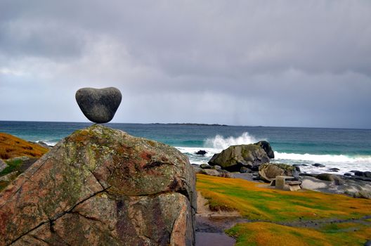 Stony heart is staying in balance on the beach