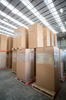 View of cardboard boxes put on pallets in a warehouse