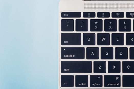 Top view laptop computer notebook isolated on blue background